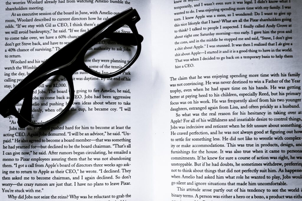 picture showing glasses on a book